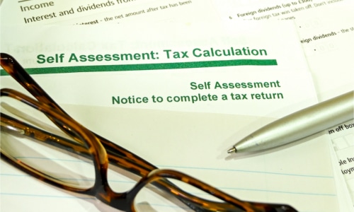 HMRC Self Assessment calculator and glasses
